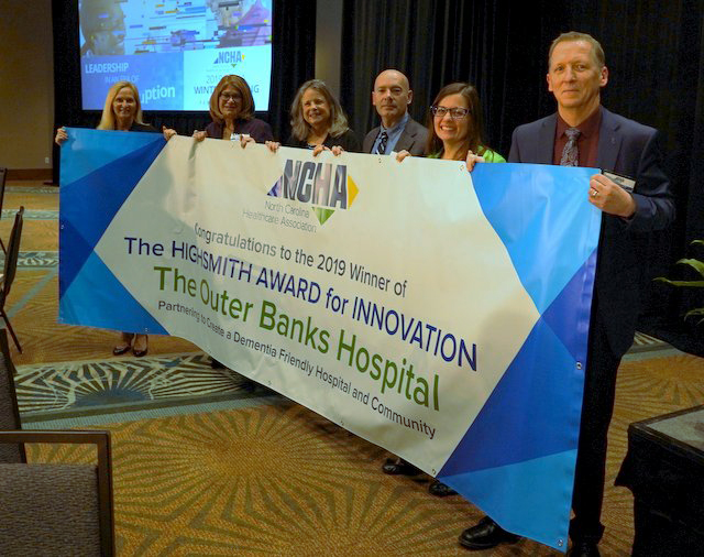 team from Outer Banks hospital holding banner that says Highsmith Award for Innovation.