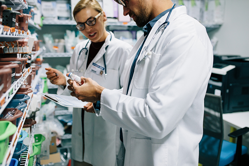 Pharmacists checking inventory at pharmacy